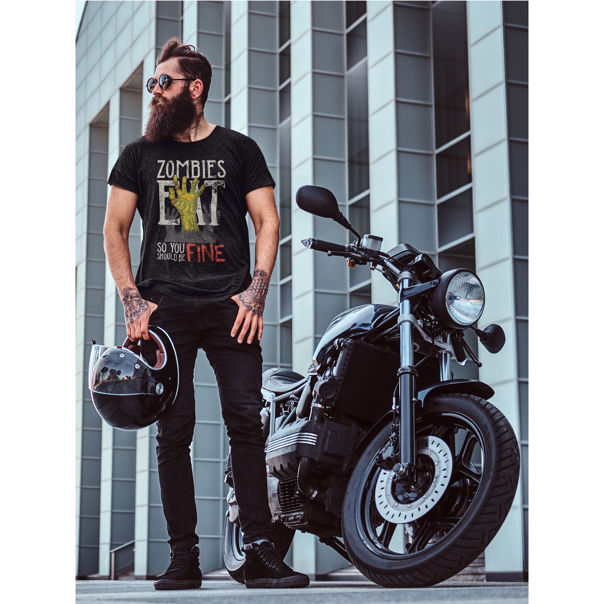 Man wearing a t-shirt with a zombie-themed design next to a motorcycle in an urban setting – Bamerix