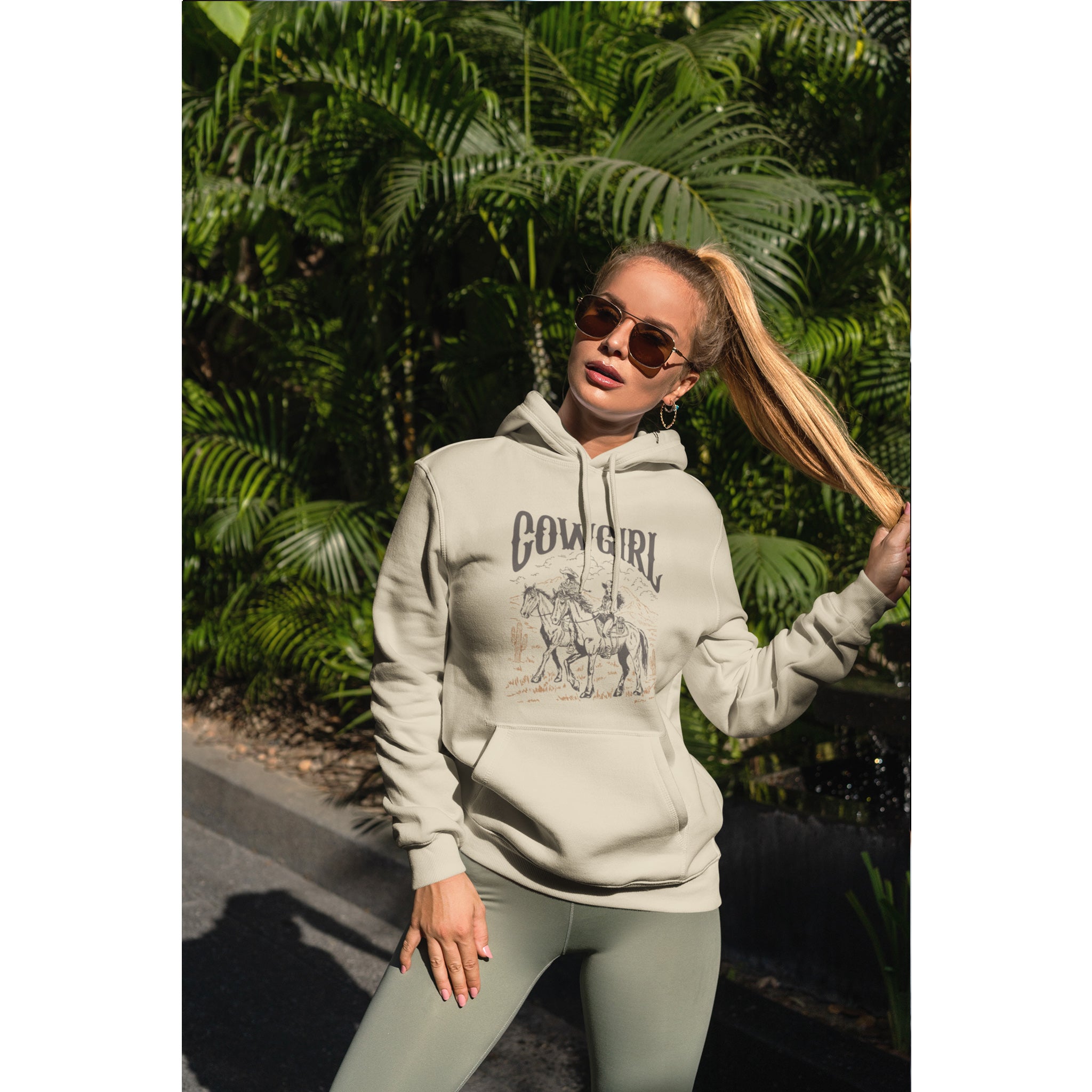 Woman wearing a 'Cowgirl' hoodie in a forest setting – Bamerix