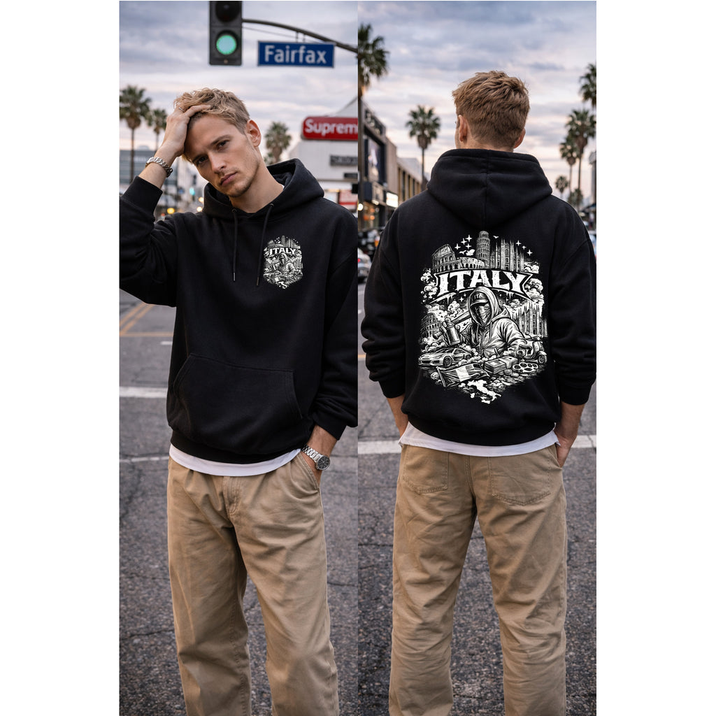 Two people wearing black hoodies with designs on a street in Los Angeles.
