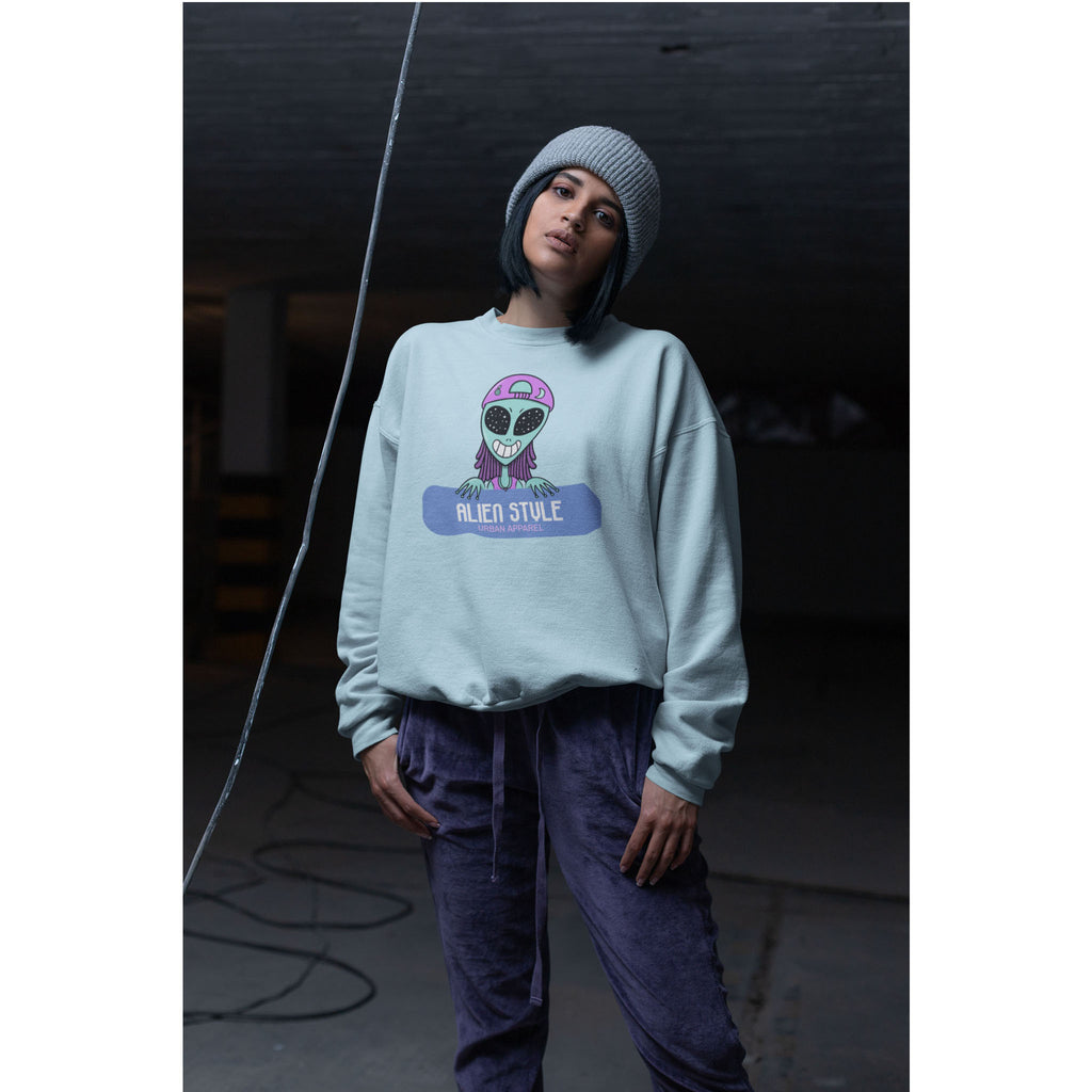 Person wearing a light blue sweatshirt with a graphic design, standing against a dark background – Bamerix