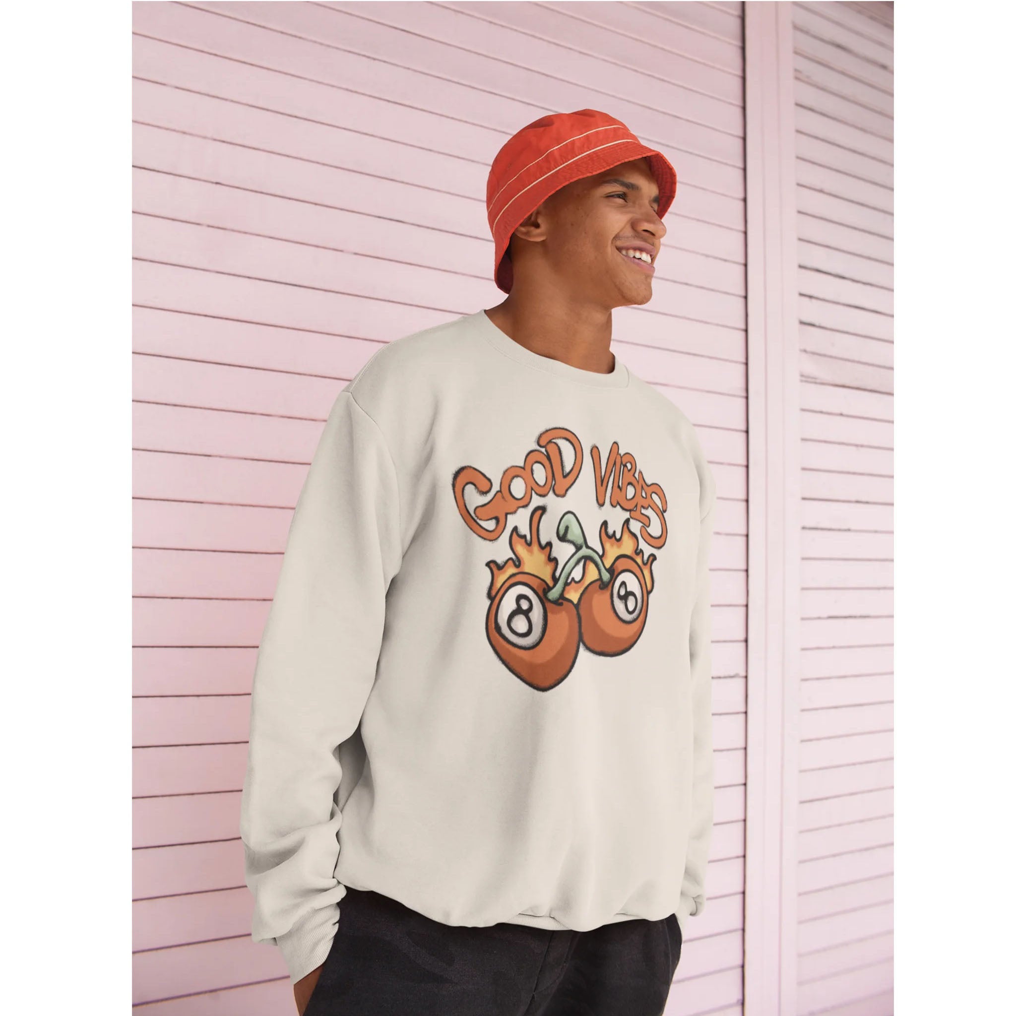 Man wearing a Good Vibes graphic sweatshirt with fruit illustration, casual streetwear style by Bamerix.