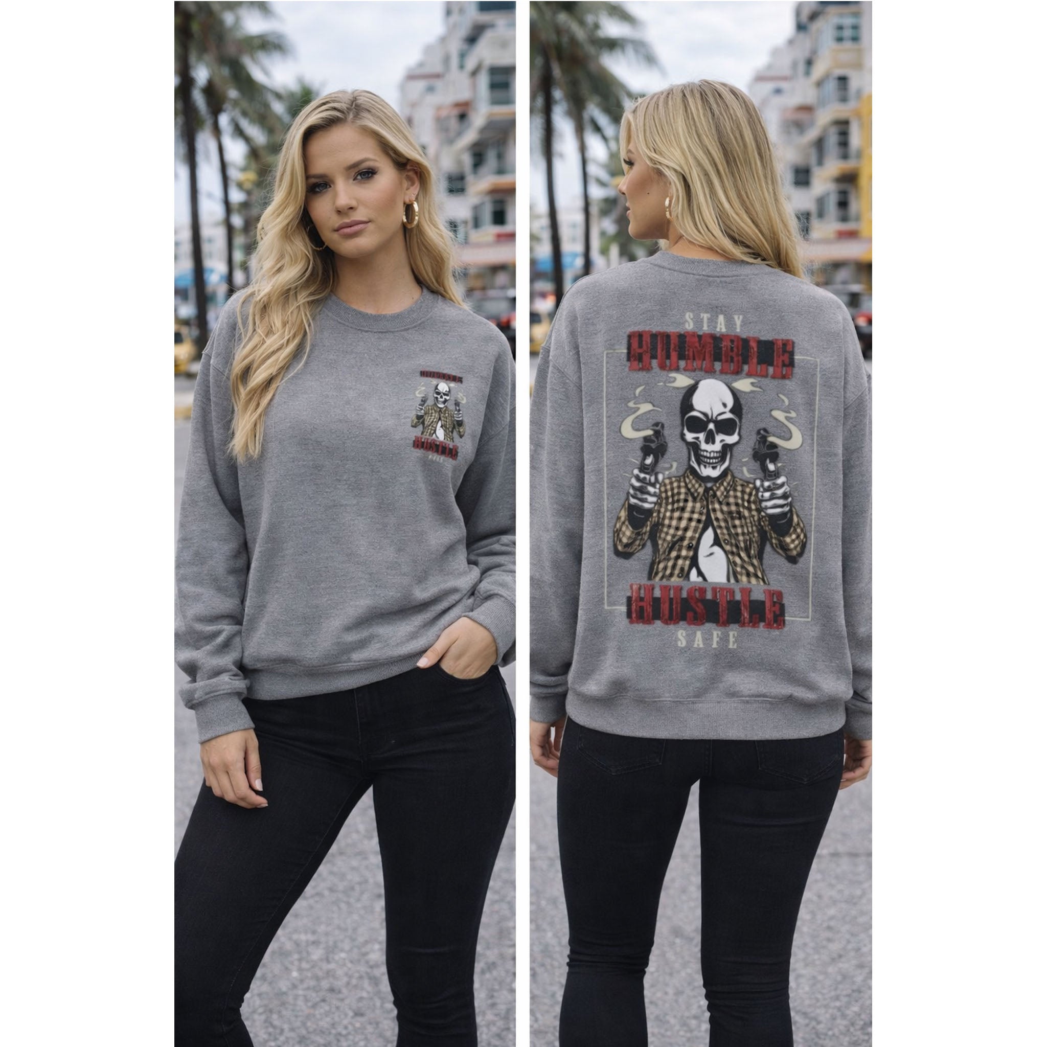 Woman wearing a gray sweatshirt with a graphic design on the front and back, standing outdoors.