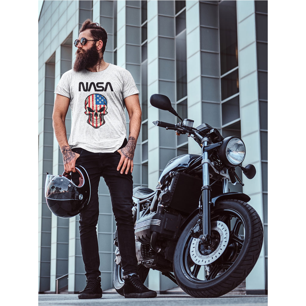 Man wearing a NASA t-shirt with a skull design, standing next to a motorcycle in an urban setting – Bamerix