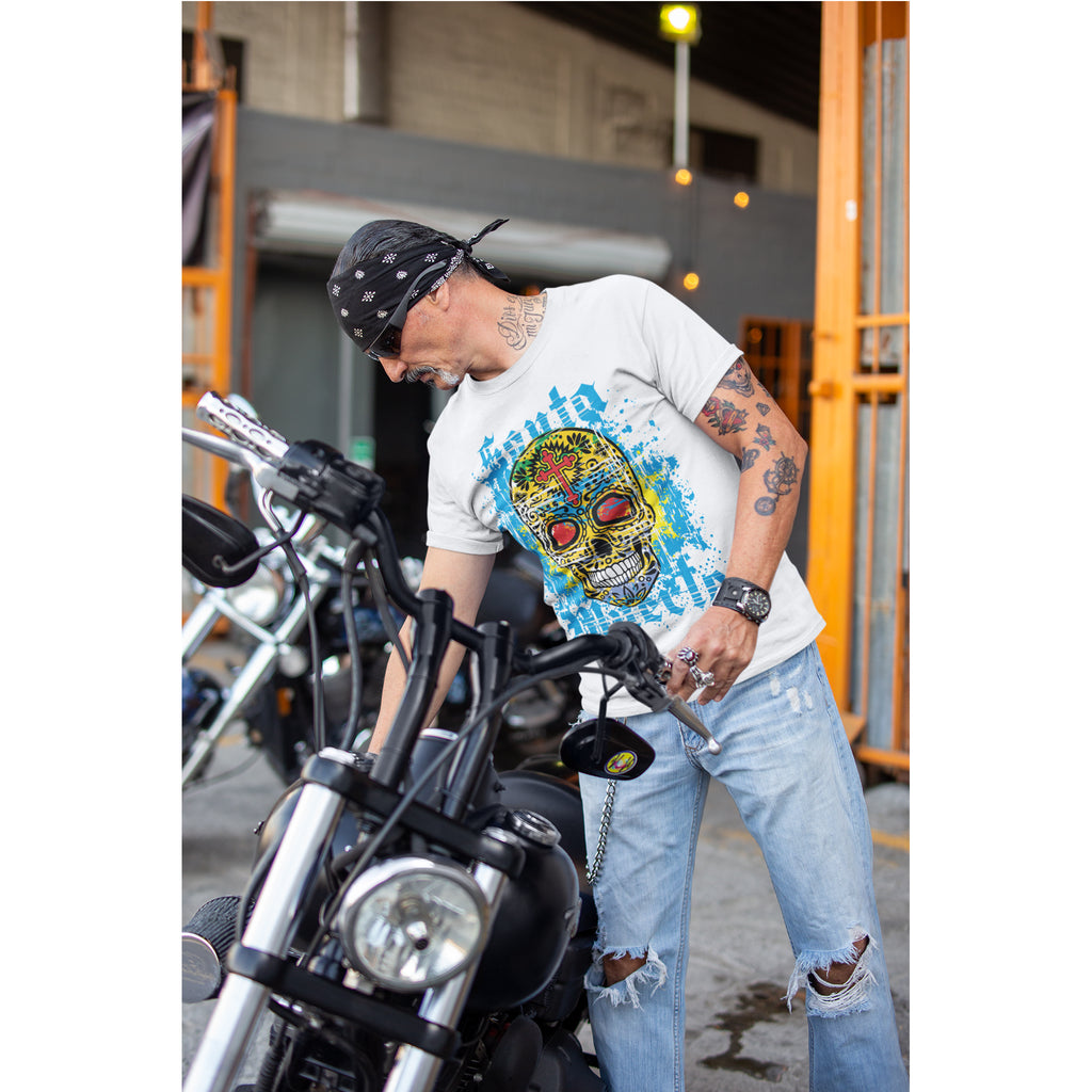Man with tattoos and a colorful skull t-shirt leaning on a motorcycle – Bamerix