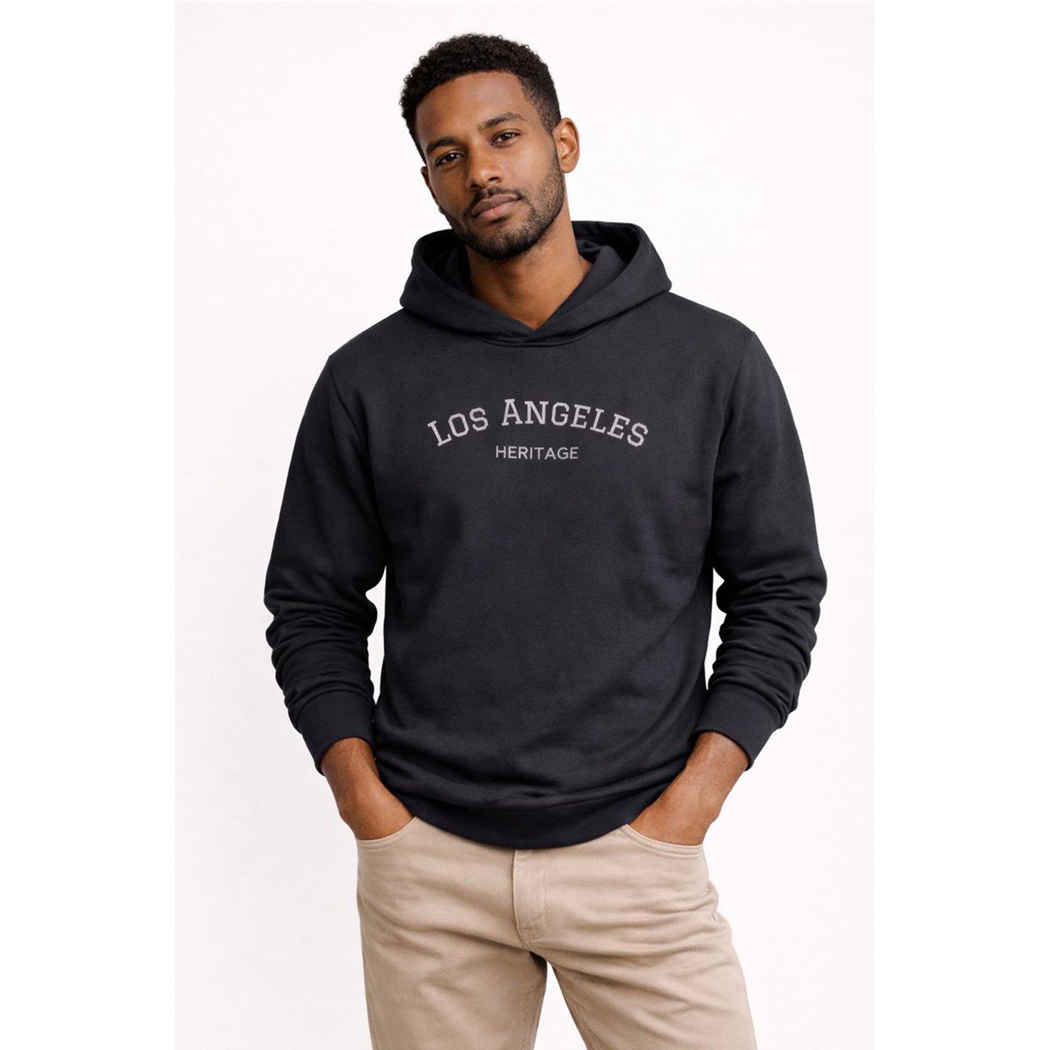Man wearing a black hoodie with 'Los Angeles Heritage' text on a white background