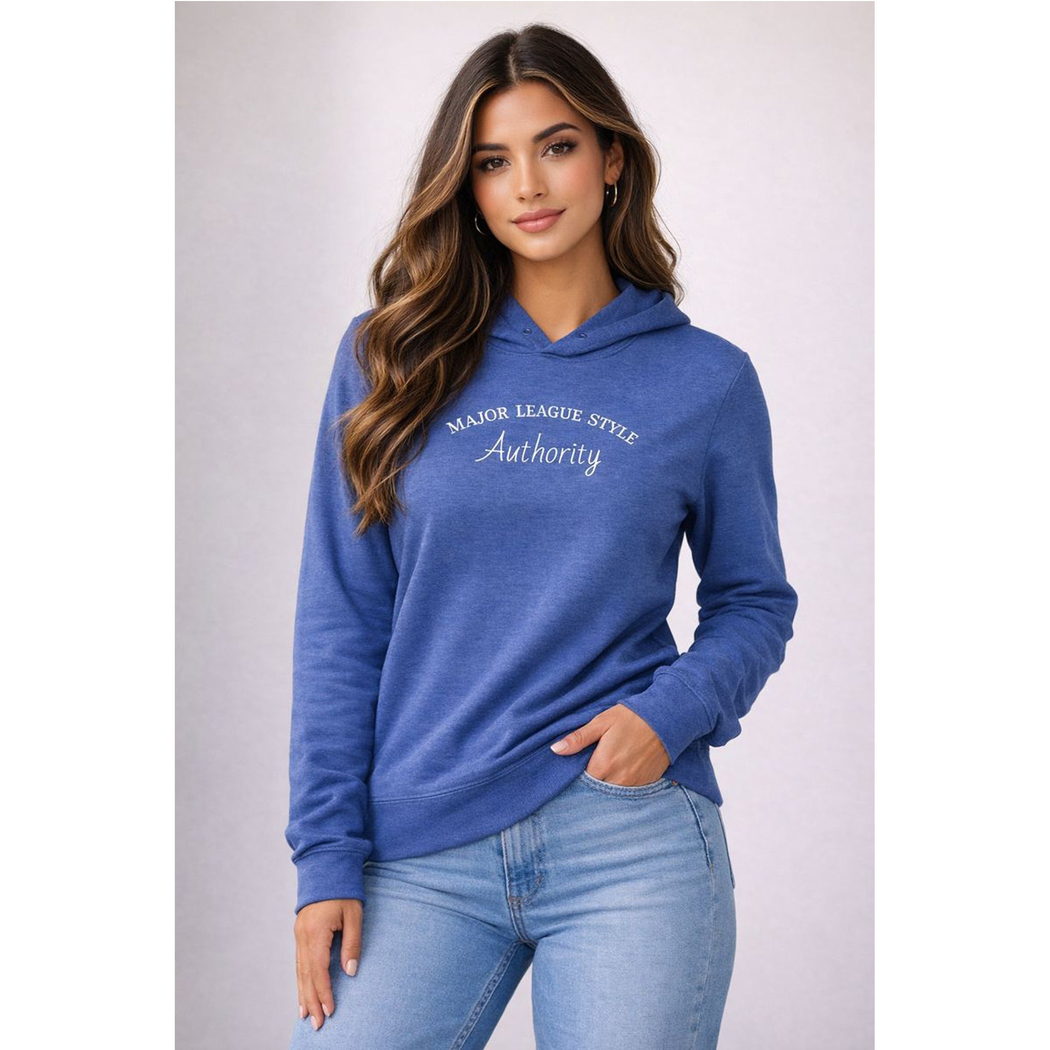 Woman wearing a blue hoodie with text, standing against a plain background