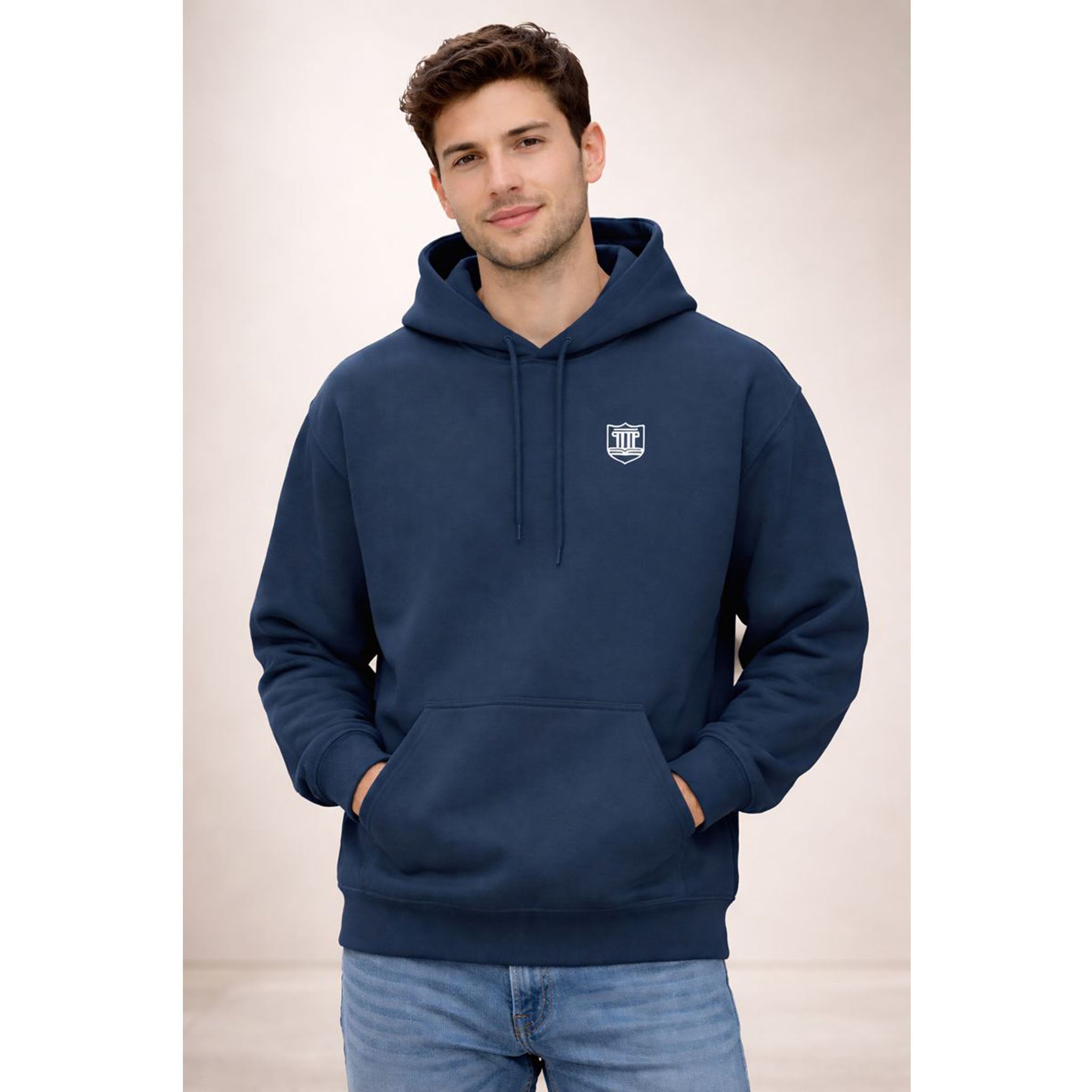Man wearing a navy blue hoodie with a logo on a beige background