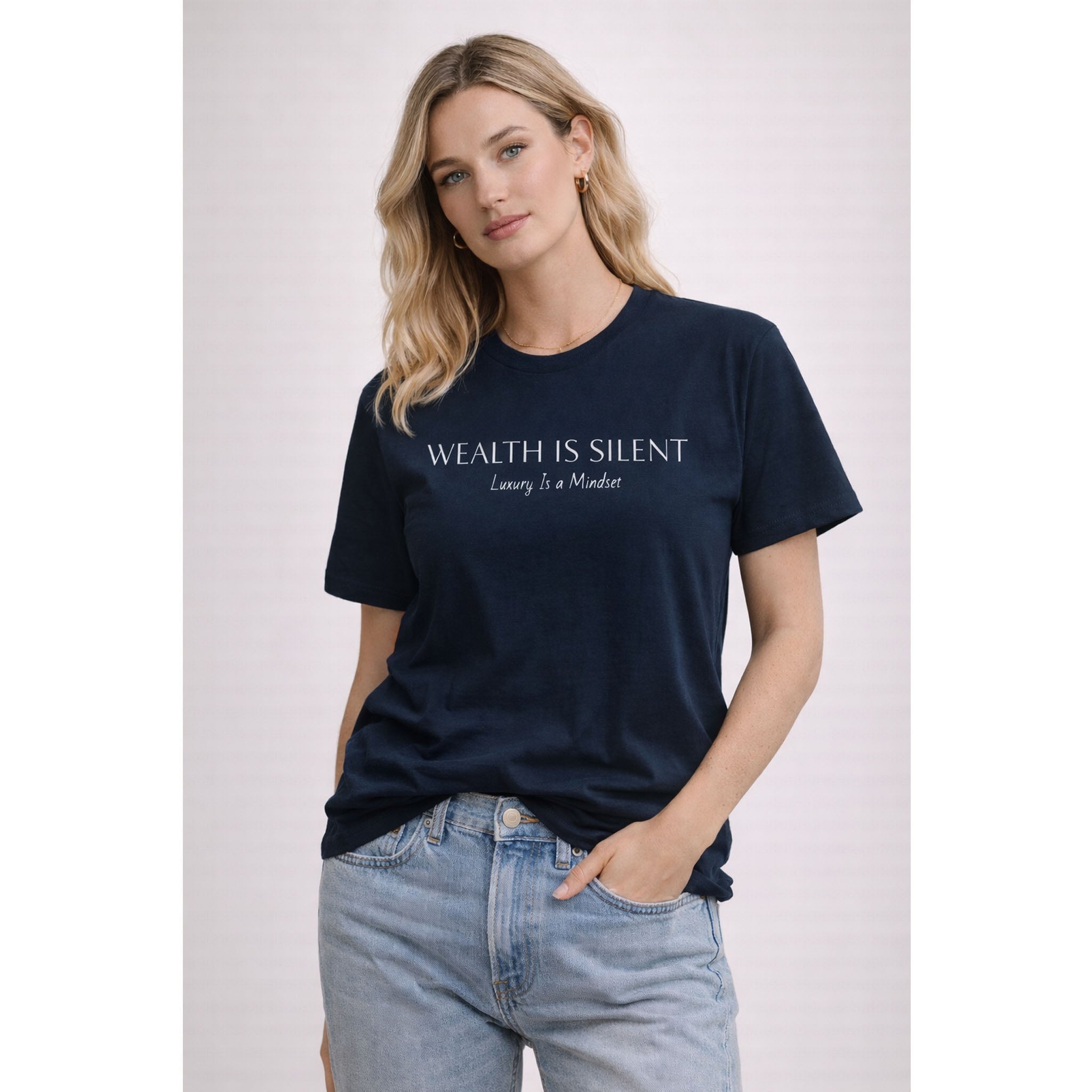 Woman wearing a navy blue t-shirt with text on a plain background