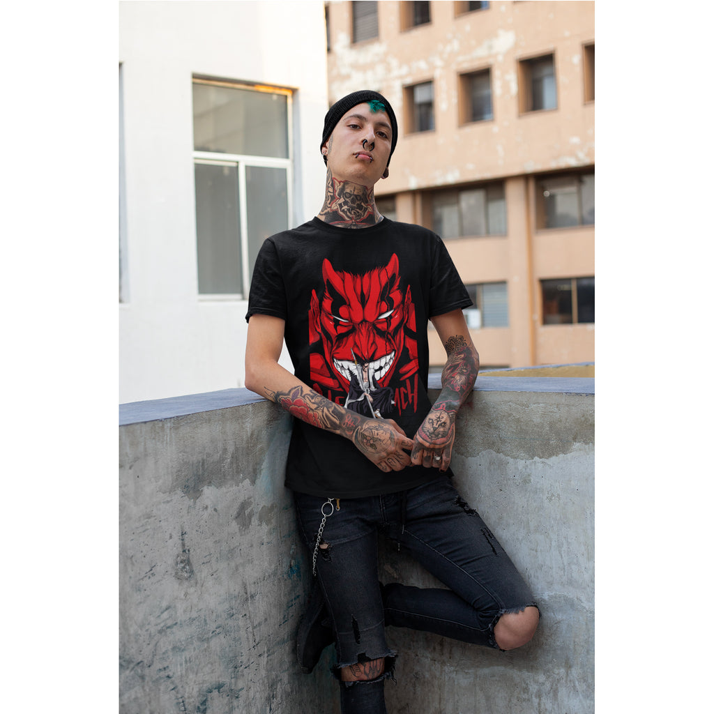 Person wearing a black t-shirt with a red graphic design, sitting on a concrete ledge.