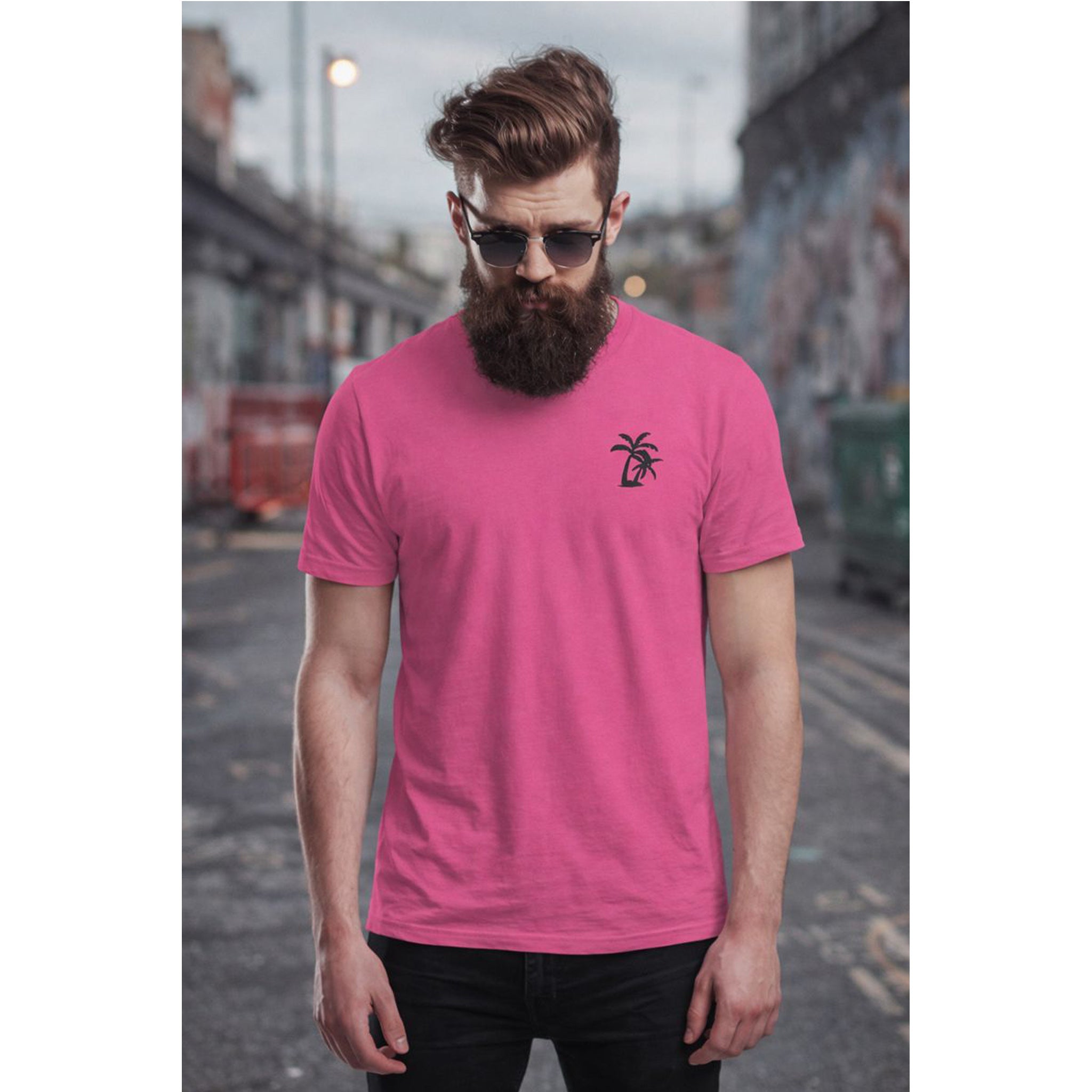 Man wearing a pink t-shirt with a palm tree design in an urban setting – Bamerix