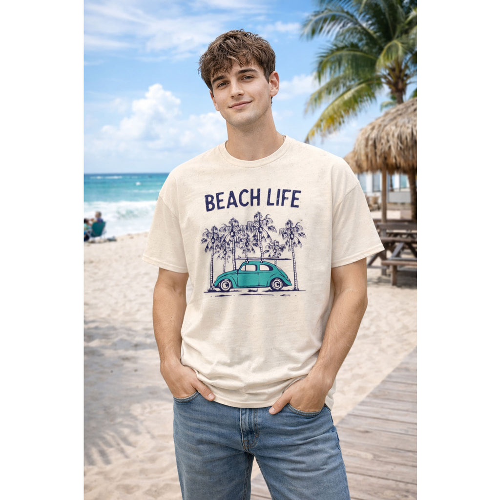 Person wearing a 'Beach Life' t-shirt with a car and palm tree design on a beach.