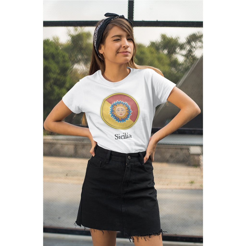 Person wearing a white t-shirt with a colorful design and text, standing outdoors.