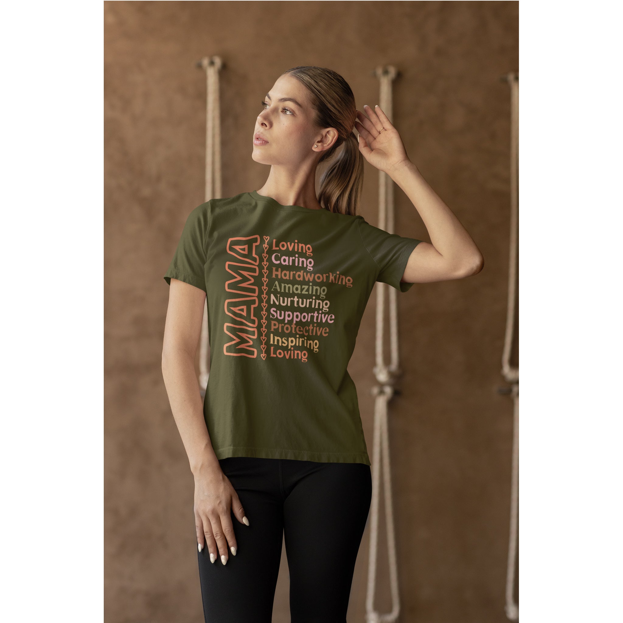 Woman wearing a green t-shirt with text in front of a wooden background