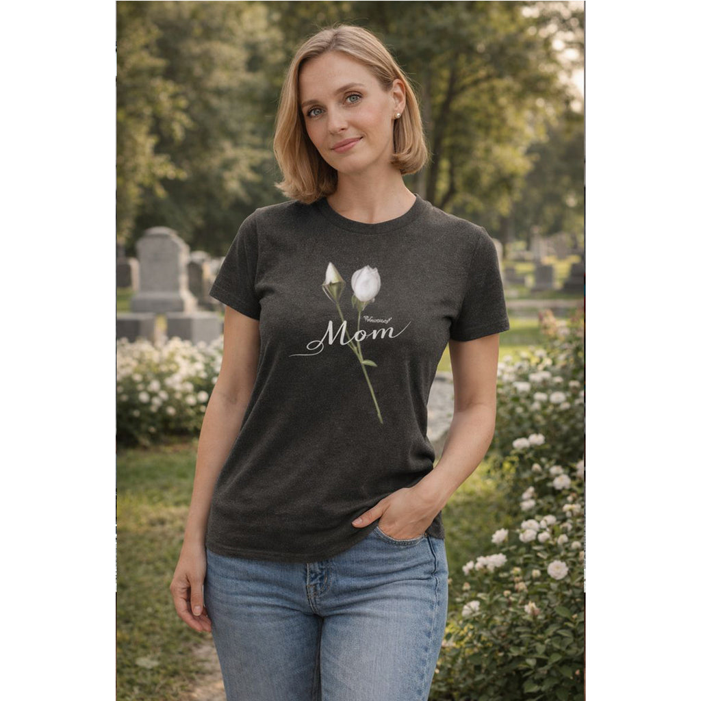 Woman wearing a dark t-shirt with a floral design and 'Mom' text in a garden setting