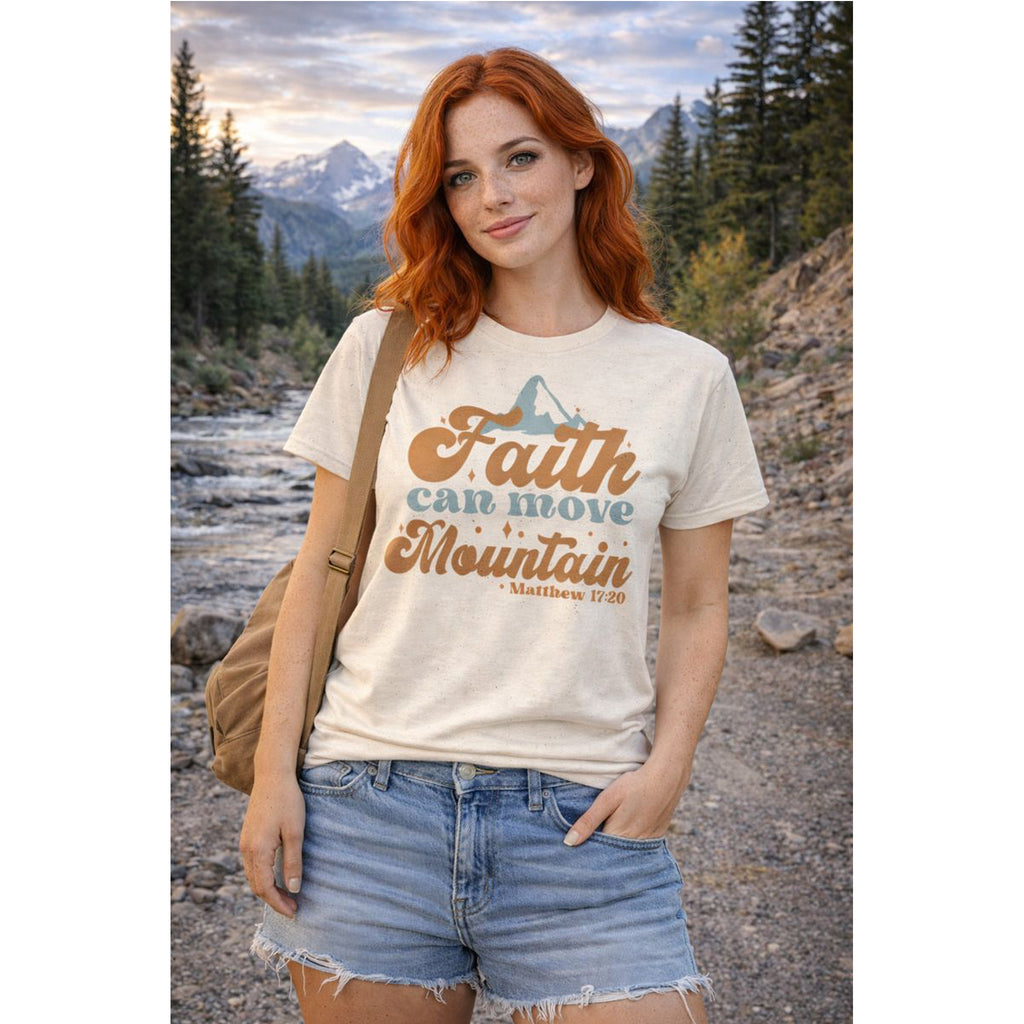 Woman wearing a t-shirt with 'Faith can move mountains' text in a natural setting – Bamerix