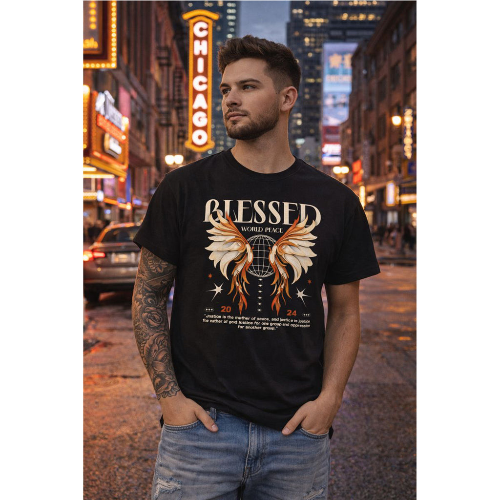 Man wearing a black t-shirt with 'Blessed' design in an urban setting with neon signs.