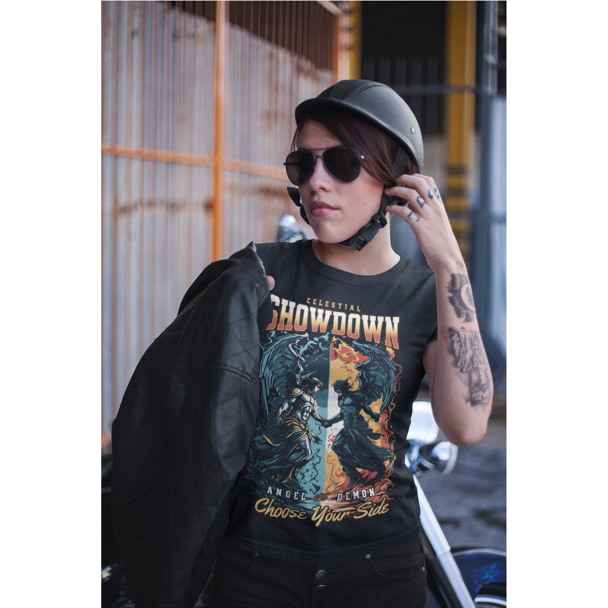 Person wearing a graphic t-shirt with a design and text, standing outdoors.