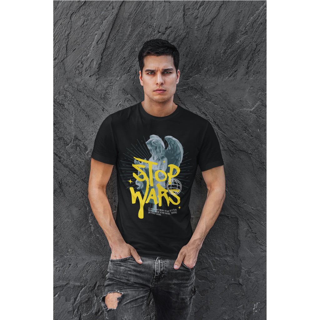Man wearing a black t-shirt with 'Stop Wars' design against a textured gray wall.
