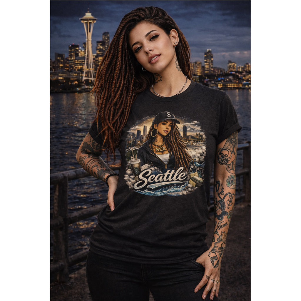 Person wearing a black t-shirt with a graphic design of a woman and 'Seattle' text, standing in front of a city skyline at night.