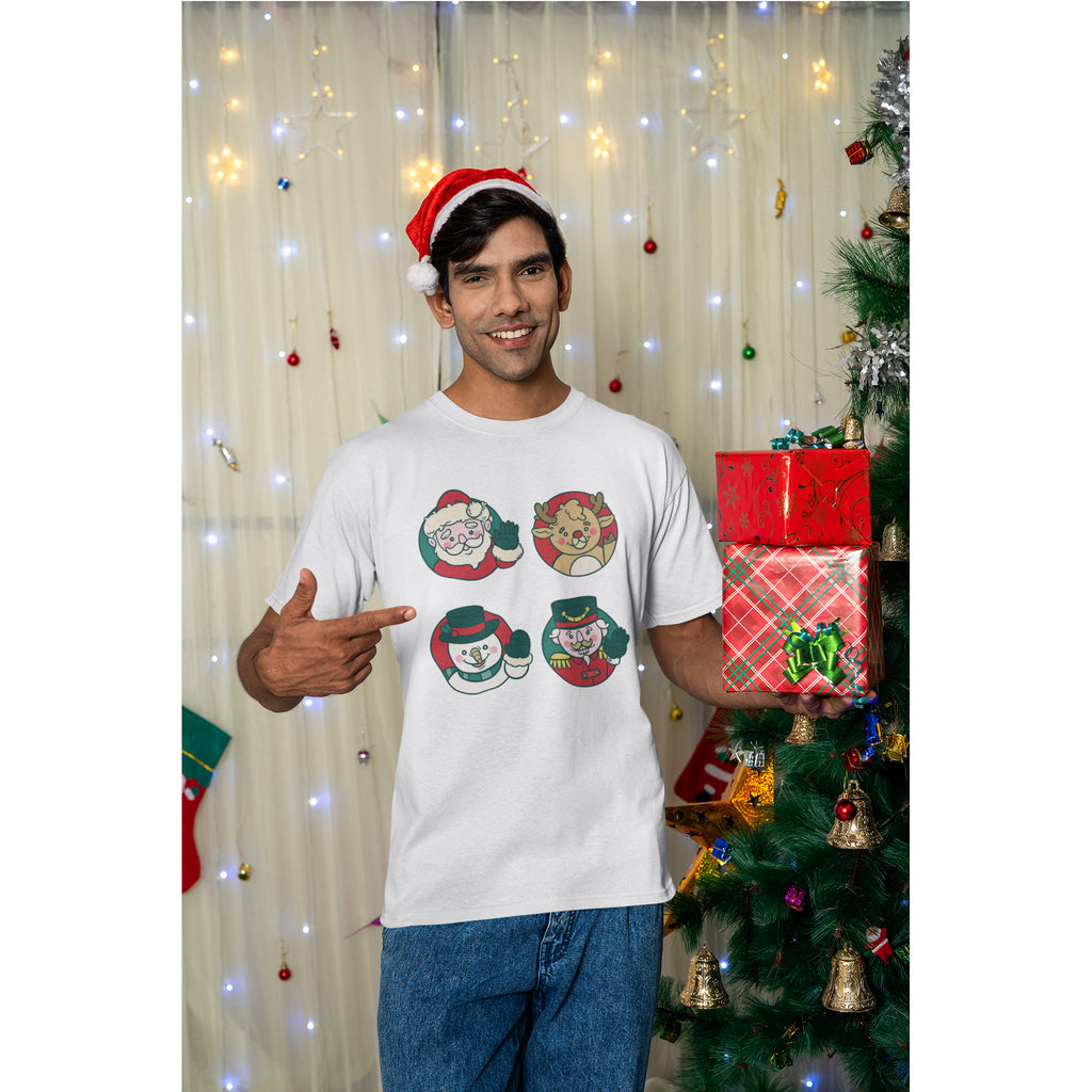 Man wearing a white t-shirt with Christmas-themed designs, pointing at himself, in front of a decorated Christmas tree and lights.