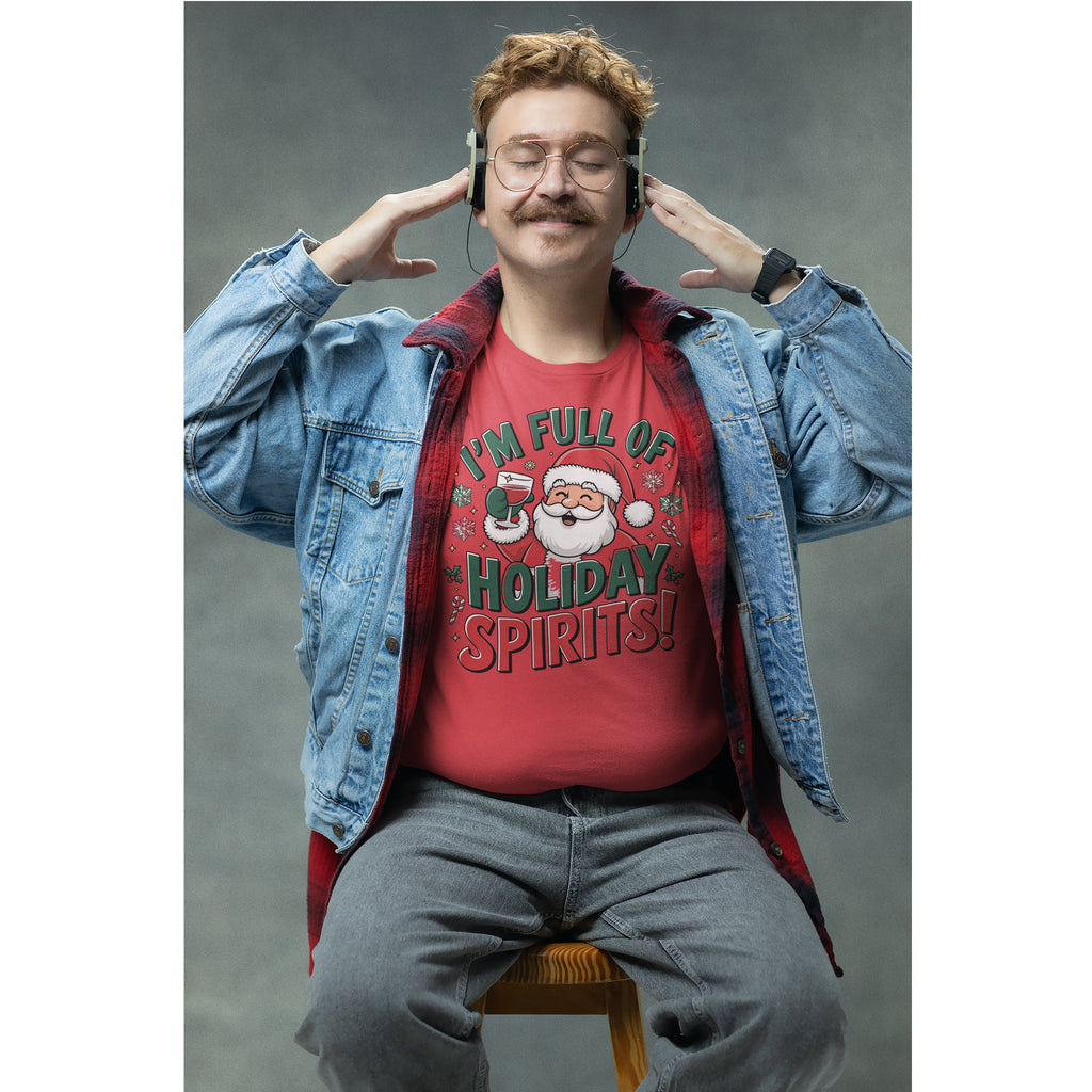 bamerix Person wearing a red shirt with holiday text and a denim jacket, sitting on a stool against a gray background.