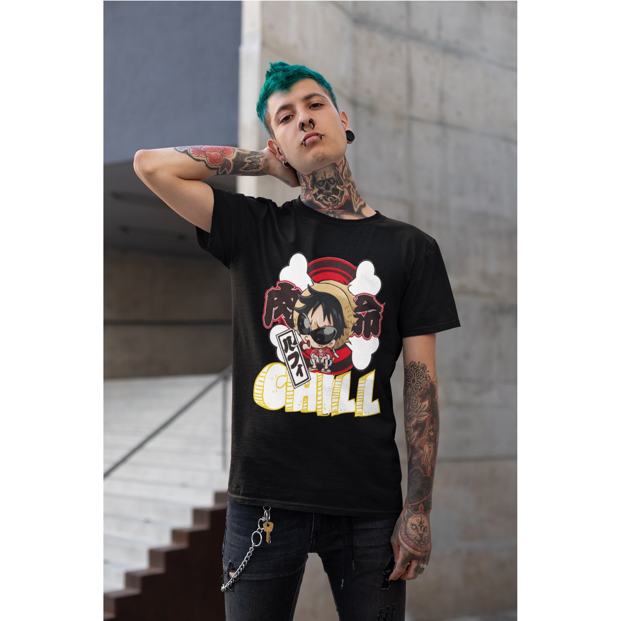 Person wearing a black t-shirt with a graphic design, standing outdoors.