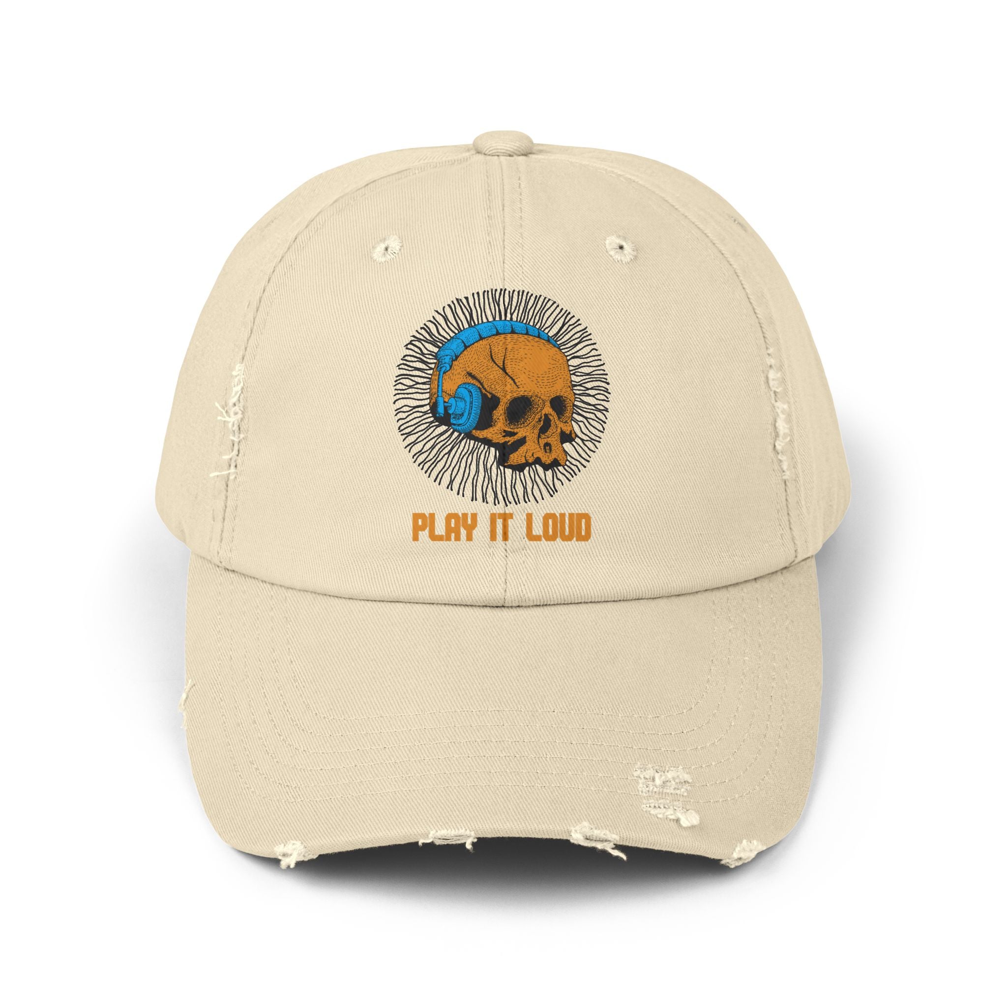 Beige cap with skull and headphone design and 'Play It Loud' text on a white background